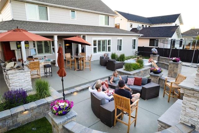 3214 Hillcrest Dr, Bozeman, MT 59715 - back of property with outdoor lounge area, a patio, outdoor dining area, and a shingled roof