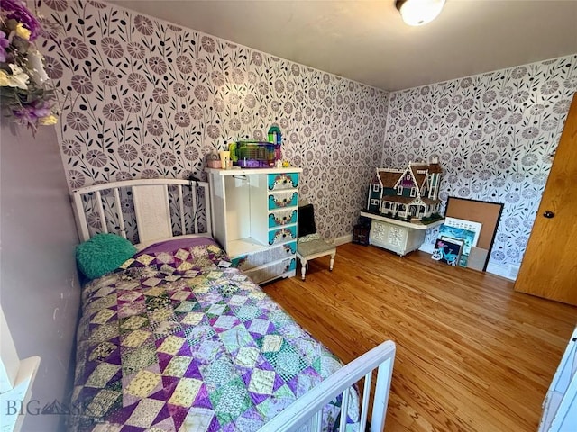 2030 Adams Ave, Butte, MT 59701 - bedroom with wallpapered walls and wood finished floors