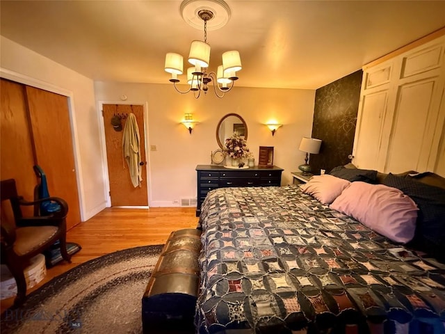 2030 Adams Ave, Butte, MT 59701 - bedroom featuring light wood-style flooring, a chandelier, and a closet