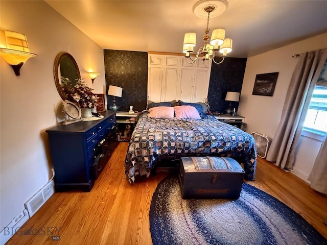 2030 Adams Ave, Butte, MT 59701 - bedroom featuring light wood-style floors and a chandelier