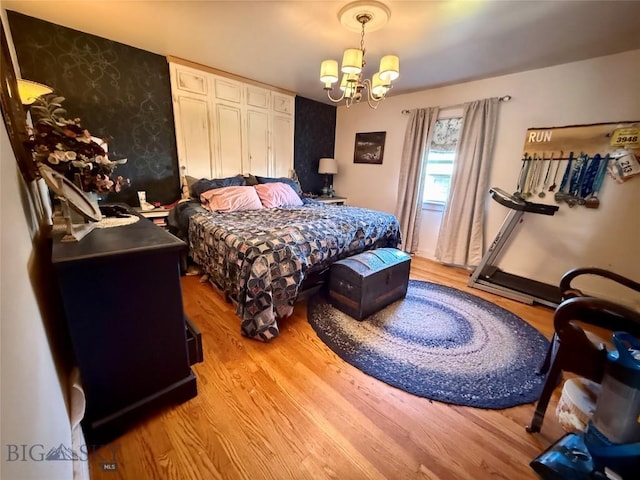 2030 Adams Ave, Butte, MT 59701 - bedroom with a chandelier, light wood-style floors, and wallpapered walls