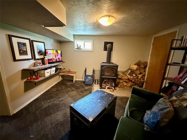 2030 Adams Ave, Butte, MT 59701 - living room with a textured ceiling, carpet, and a wood stove