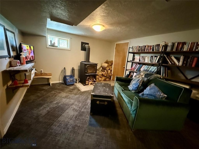 2030 Adams Ave, Butte, MT 59701 - sitting room with a wood stove, a textured ceiling, and carpet flooring