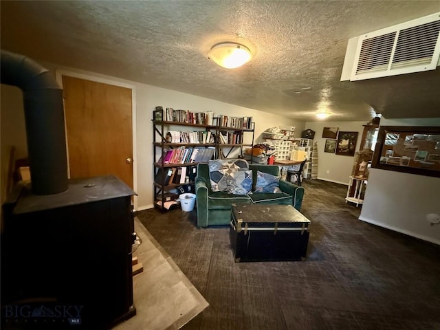 2030 Adams Ave, Butte, MT 59701 - home office featuring a textured ceiling and a wood stove