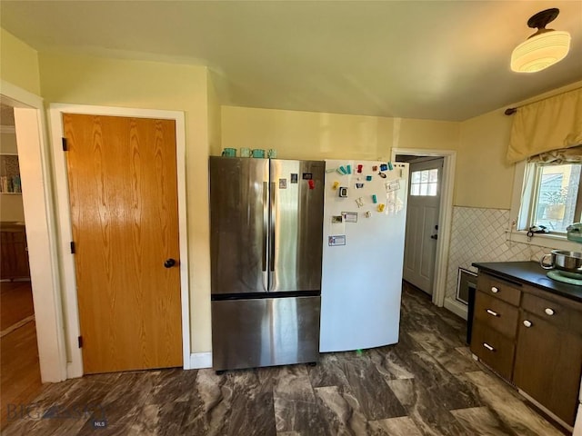 2030 Adams Ave, Butte, MT 59701 - kitchen featuring freestanding refrigerator, dark countertops, and dark brown cabinets