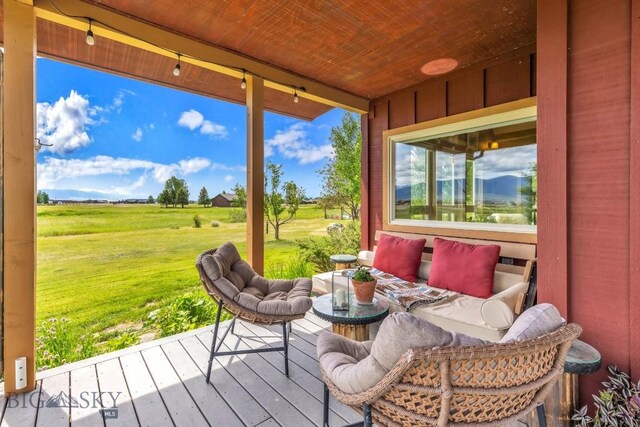 13 Blue Wing Rd, Ennis, MT 59729 - wooden terrace with a lawn and an outdoor hangout area