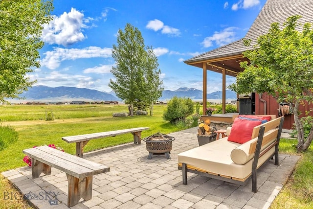 13 Blue Wing Rd, Ennis, MT 59729 - view of patio with a fire pit and a mountain view
