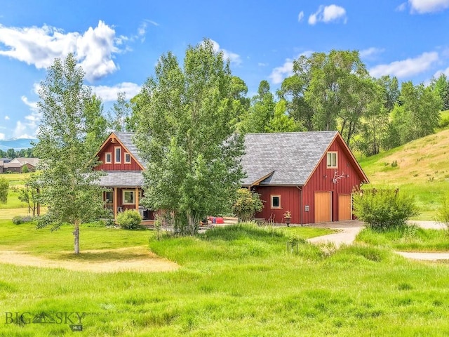 13 Blue Wing Rd, Ennis, MT 59729 - view of front of home featuring a barn, a detached garage, an outdoor structure, driveway, and a front lawn