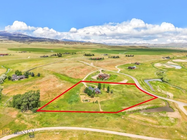 13 Blue Wing Rd, Ennis, MT 59729 - aerial view of sparsely populated area with property boundaries highlighted and a mountainous background