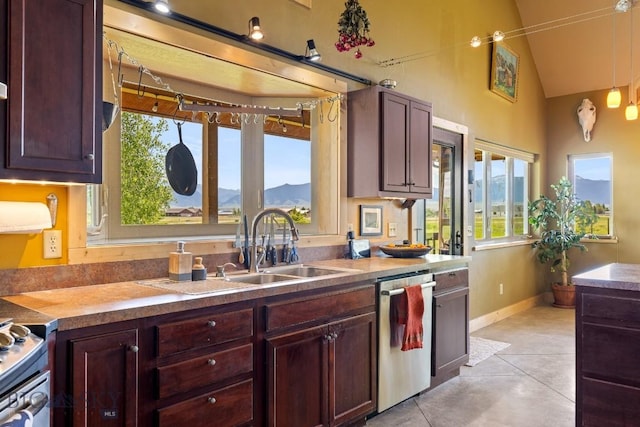 13 Blue Wing Rd, Ennis, MT 59729 - kitchen with stainless steel dishwasher, healthy amount of natural light, range, vaulted ceiling, and pendant lighting