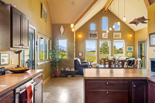 13 Blue Wing Rd, Ennis, MT 59729 - kitchen featuring high vaulted ceiling, beam ceiling, pendant lighting, open floor plan, and dishwasher