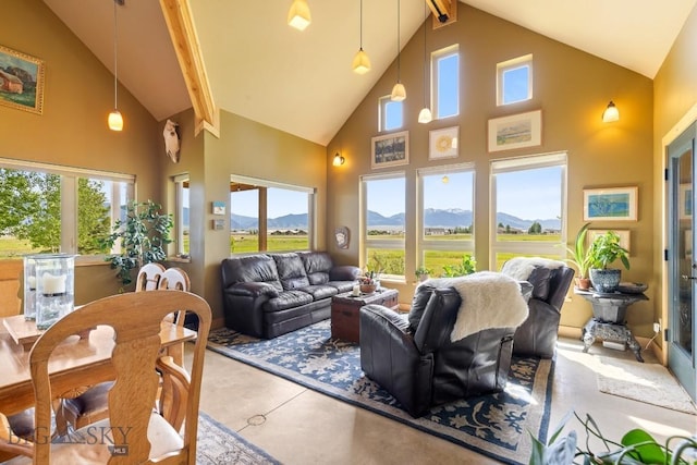 13 Blue Wing Rd, Ennis, MT 59729 - living area with high vaulted ceiling, a mountain view, plenty of natural light, and beamed ceiling