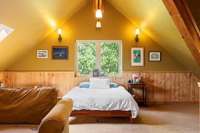 13 Blue Wing Rd, Ennis, MT 59729 - bedroom featuring lofted ceiling, a wainscoted wall, wooden walls, carpet floors, and a skylight