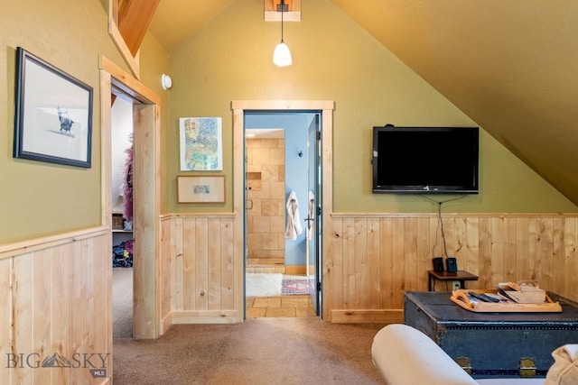 13 Blue Wing Rd, Ennis, MT 59729 - bedroom featuring a wainscoted wall, lofted ceiling, carpet floors, ensuite bathroom, and wood walls