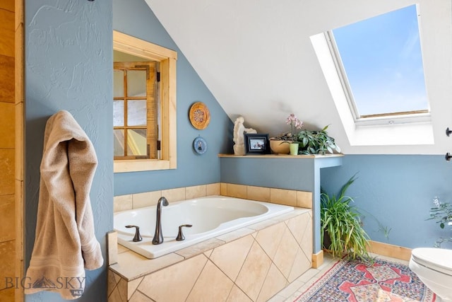 13 Blue Wing Rd, Ennis, MT 59729 - bathroom with a skylight, lofted ceiling, and a garden tub