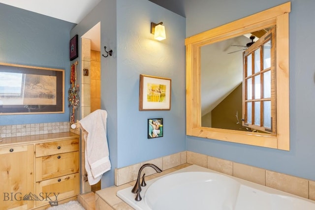 13 Blue Wing Rd, Ennis, MT 59729 - bathroom with ceiling fan, a garden tub, and healthy amount of natural light