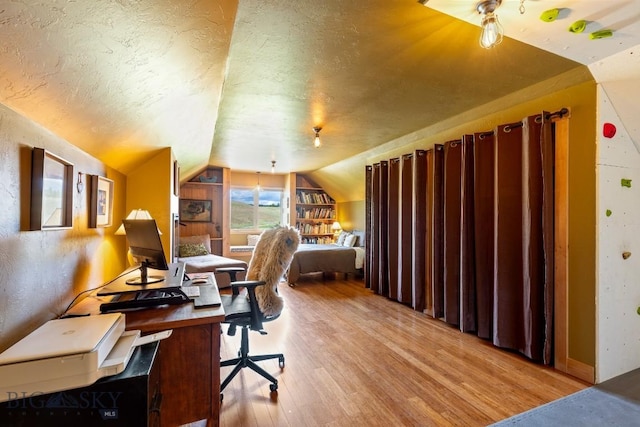 13 Blue Wing Rd, Ennis, MT 59729 - office area featuring light wood-type flooring, vaulted ceiling, and a textured ceiling