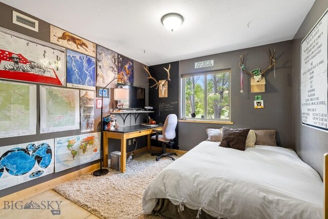 13 Blue Wing Rd, Ennis, MT 59729 - tiled bedroom featuring a desk
