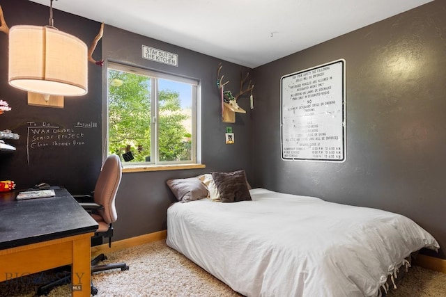 13 Blue Wing Rd, Ennis, MT 59729 - carpeted bedroom with a desk and baseboards