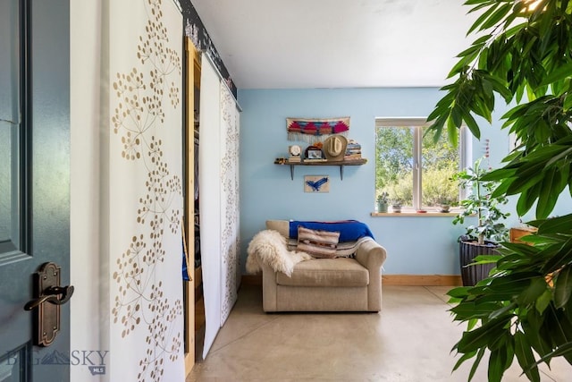 13 Blue Wing Rd, Ennis, MT 59729 - living area featuring baseboards and concrete floors