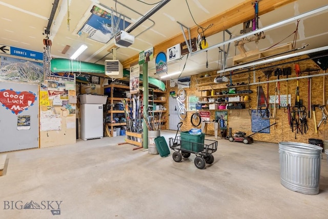 13 Blue Wing Rd, Ennis, MT 59729 - garage featuring a garage door opener