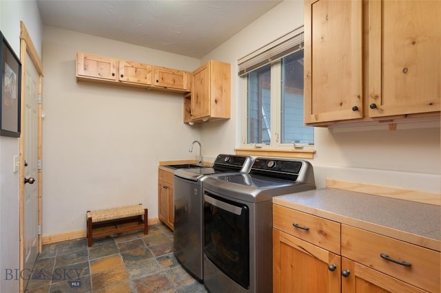 3140 Two Moons Rd, Big Sky, MT 59716 - laundry area with independent washer and dryer, stone finish floors, and cabinet space