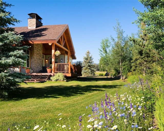 3140 Two Moons Rd, Big Sky, MT 59716 - view of green lawn featuring a wooden deck