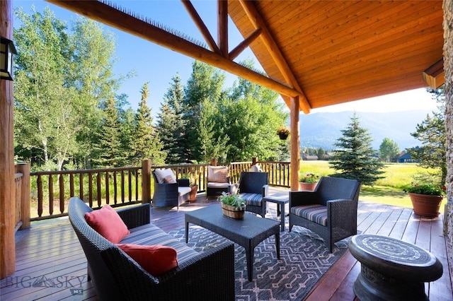 3140 Two Moons Rd, Big Sky, MT 59716 - wooden deck with an outdoor living space and a mountain view