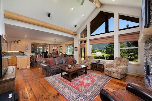 3140 Two Moons Rd, Big Sky, MT 59716 - living room featuring beam ceiling, dark wood-style flooring, a stone fireplace, recessed lighting, and high vaulted ceiling