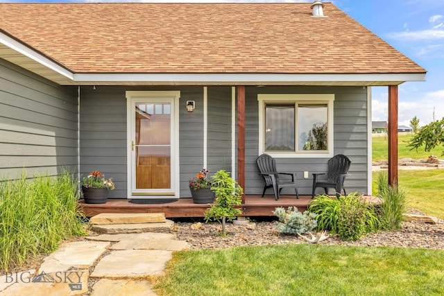 418 May Ln, Belgrade, MT 59714 - doorway to property with covered porch and a shingled roof