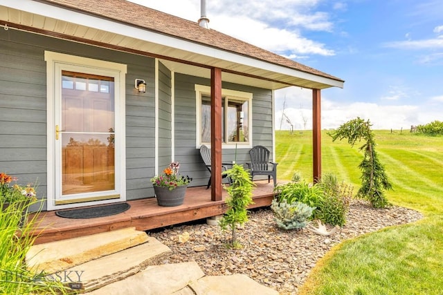 418 May Ln, Belgrade, MT 59714 - view of exterior entry featuring a porch and a lawn