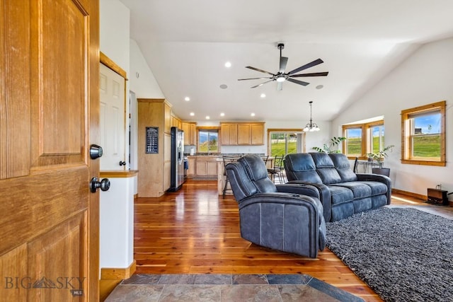 418 May Ln, Belgrade, MT 59714 - living area with lofted ceiling, a ceiling fan, healthy amount of natural light, wood finished floors, and recessed lighting