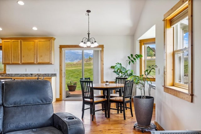 418 May Ln, Belgrade, MT 59714 - dining space featuring light wood finished floors, a chandelier, recessed lighting, and vaulted ceiling