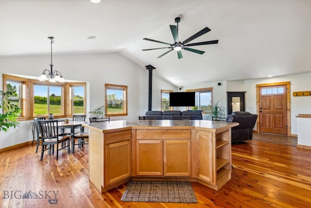 418 May Ln, Belgrade, MT 59714 - kitchen featuring ceiling fan, lofted ceiling, wood-type flooring, open floor plan, and hanging light fixtures