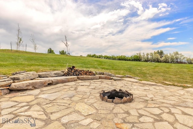 418 May Ln, Belgrade, MT 59714 - view of patio / terrace with a fire pit and a view of countryside