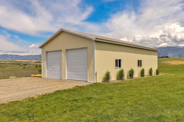418 May Ln, Belgrade, MT 59714 - detached garage featuring a mountain view