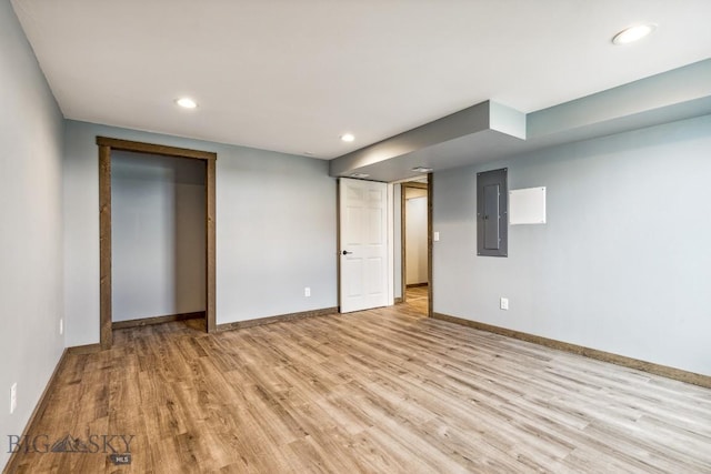 418 May Ln, Belgrade, MT 59714 - unfurnished bedroom with electric panel, light wood-style flooring, and recessed lighting