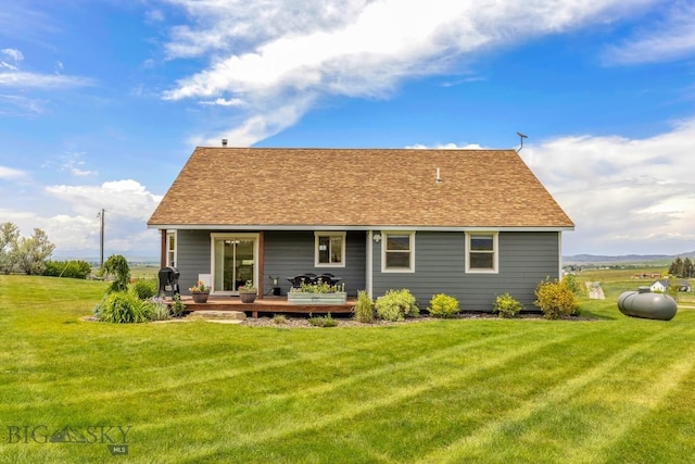 418 May Ln, Belgrade, MT 59714 - rear view of property with a lawn and a shingled roof