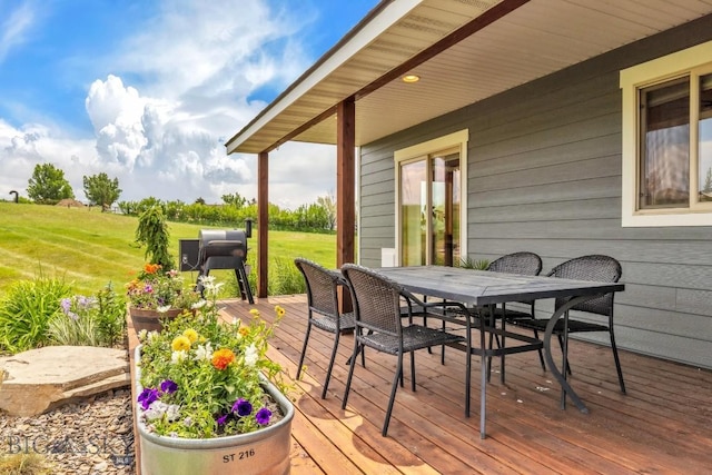 418 May Ln, Belgrade, MT 59714 - deck featuring outdoor dining area and a lawn