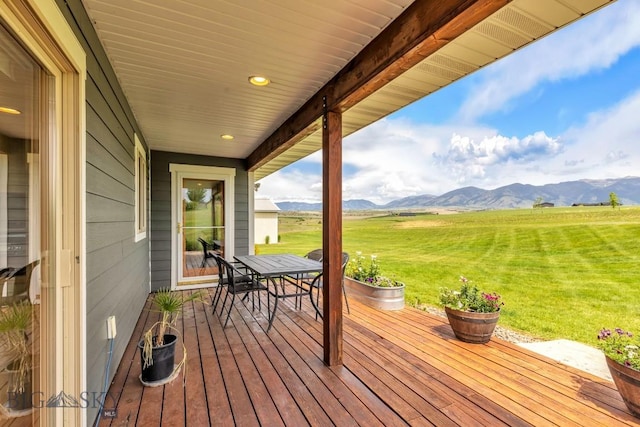 418 May Ln, Belgrade, MT 59714 - wooden terrace featuring a mountain view, a yard, a rural view, and outdoor dining space