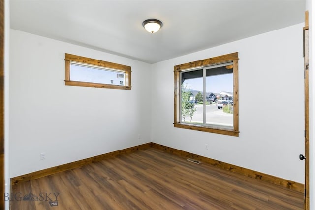 702 Pleiades, Livingston, MT 59047 - empty room with baseboards and dark wood finished floors