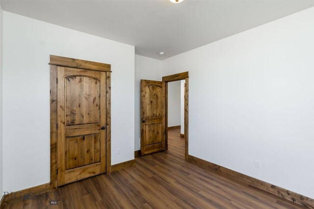 702 Pleiades, Livingston, MT 59047 - unfurnished bedroom featuring baseboards and wood finished floors