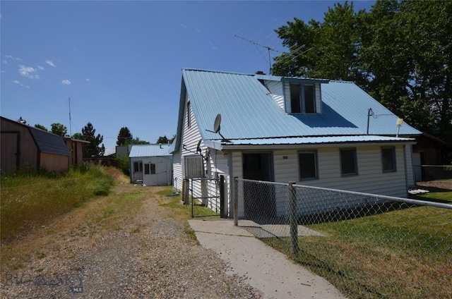 103 Flick, Sheridan, MT 59749 - bungalow-style home featuring a metal roof and driveway