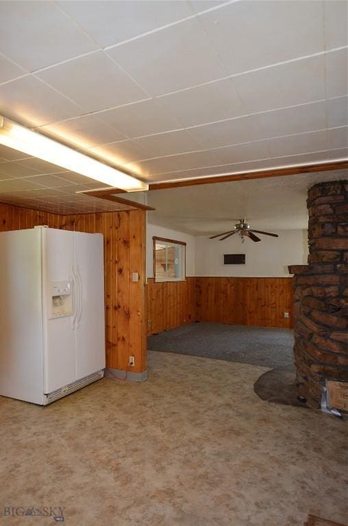 103 Flick, Sheridan, MT 59749 - unfurnished living room with wooden walls, wainscoting, and ceiling fan