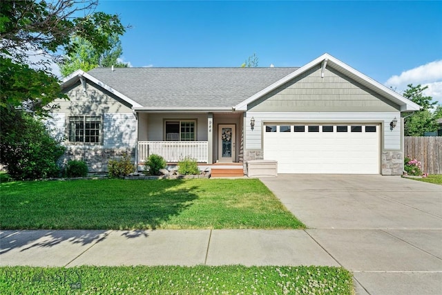 944 Forest Glen Dr, Bozeman, MT 59718 - single story home with stone siding, covered porch, a garage, and concrete driveway