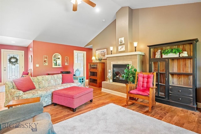 944 Forest Glen Dr, Bozeman, MT 59718 - living room with a ceiling fan, wood finished floors, high vaulted ceiling, and a glass covered fireplace
