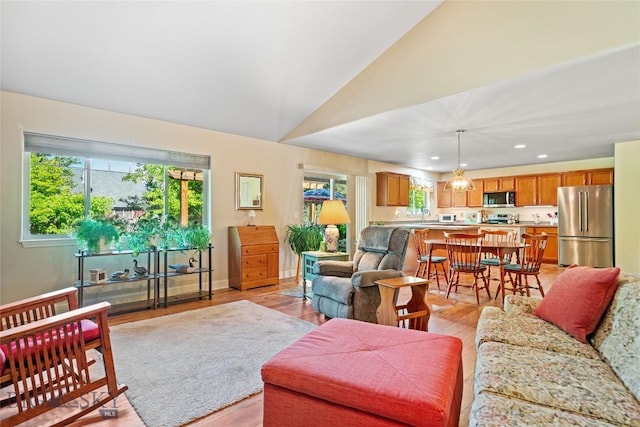 944 Forest Glen Dr, Bozeman, MT 59718 - living room featuring light wood-type flooring, vaulted ceiling, and recessed lighting