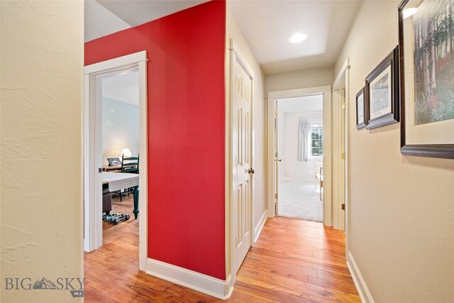 944 Forest Glen Dr, Bozeman, MT 59718 - hallway with light wood-style flooring and an office area