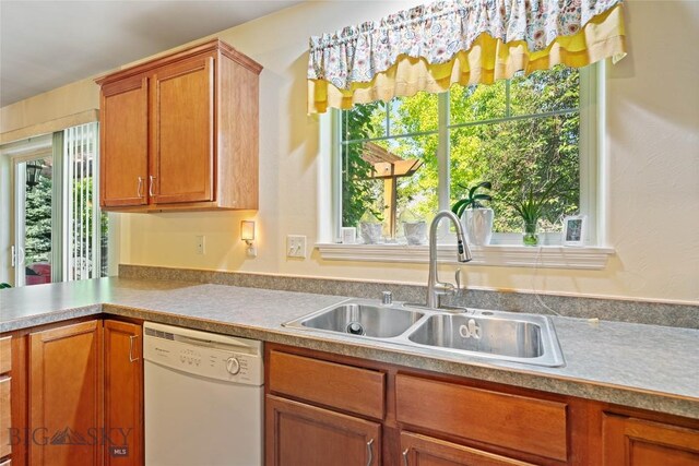 944 Forest Glen Dr, Bozeman, MT 59718 - kitchen with white dishwasher, plenty of natural light, and light countertops