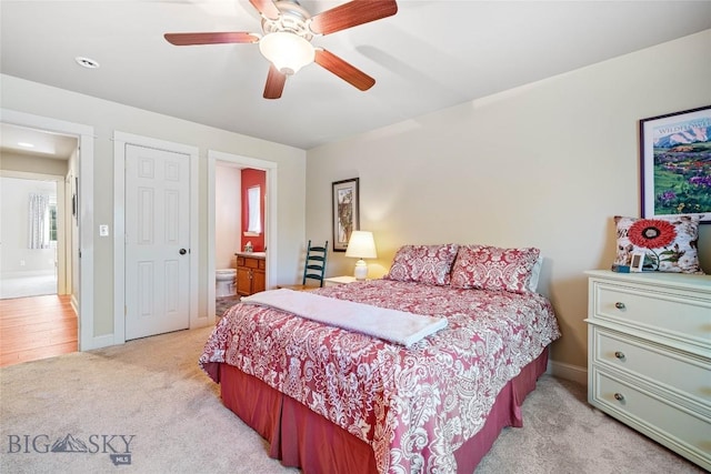944 Forest Glen Dr, Bozeman, MT 59718 - bedroom with light carpet, ceiling fan, and ensuite bathroom